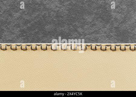 Flock and leather stitched using square stitches. Furniture finishing, close-up Stock Photo