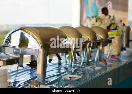 The silver-covered buffet dining area at an event in Indonesia Stock Photo