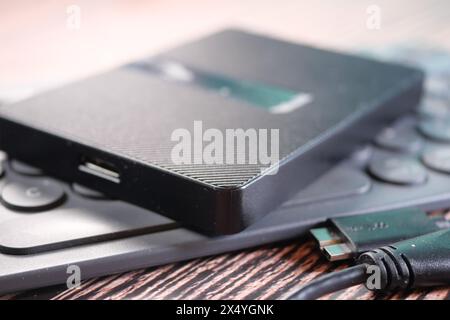 external hard drives on a keyboard on table  Stock Photo
