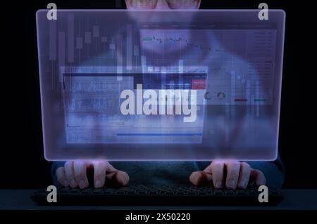 Close-up of a man's hands on a laptop keyboard and virtual screen with business, banking and financial diagrams. Concept of business and financial ind Stock Photo