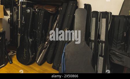 shot of guitar bags leaning on the wall in the music studio. High quality photo Stock Photo