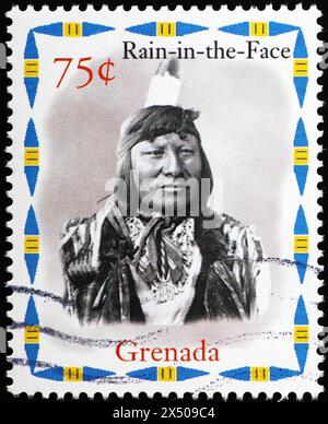 Indian chief Rain-in-the-face on stamp from Grenada Stock Photo