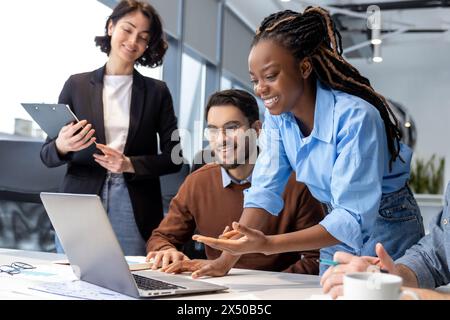 Multicultural businesspeople young entrepreneurs collaborating on new project Stock Photo