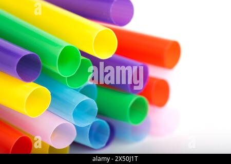 Colorful plastic drinking straws on white background. Close up Stock Photo