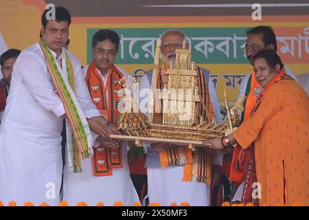 Prime Minister Narendra Modi is felicitated by Tripura Chief Minister Dr. Manik Saha, BJP candidate and former CM of Tripura, Biplab Kumar Deb, Kriti Debbarma, party president Rajib Bhattacharjee, and other leaders during a rally ahead of the Lok Sabha Election in Agartala, Tripura, India. Stock Photo