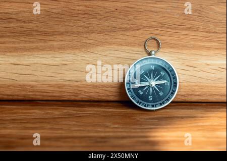 Compass on wooden background with copy space using as direction Stock Photo