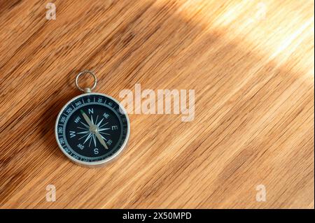 Compass on wooden background with copy space using as direction Stock Photo