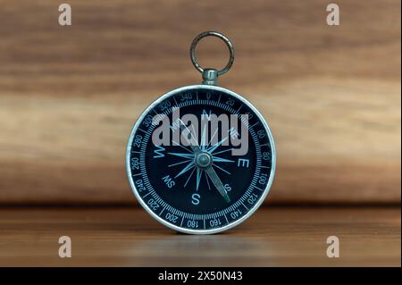 Compass on wooden background with copy space using as direction Stock Photo