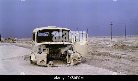 2nd April 1991 Near the ancient Sumerian city of Ur in southern Iraq, a US soldier grabs some sleep in a wrecked Iraqi Army truck. Stock Photo