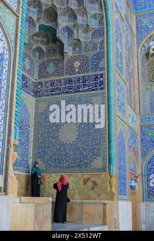 Isfahan, Iran - April 1, 2024: Women visiting the Sheikh Lotfollah Mosque, it is located in Naghsh-e Jahan Square in Isfahan, Iran. Stock Photo