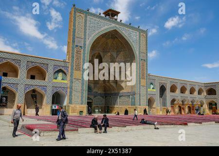 Isfahan, Iran - April 1, 2024: People visiting the Jameh Mosque also known as the Atiq Mosque in Isfahan, Iran. Stock Photo