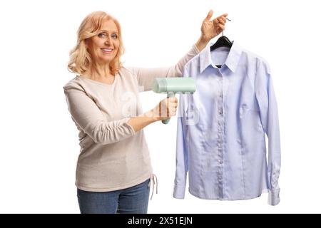 Woman using a hand steam iron for a shirt isolated on white background Stock Photo