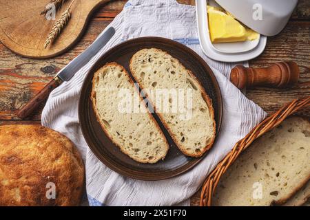 Rustic sourdough bread breakfast setup on rustic background Stock Photo