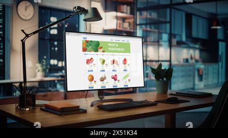 Shot of a Desktop Computer with Food App User Interface Developing Software Standing on the Wooden Desk in the Creative Cozy Living Room. In the Background Warm Evening Lighting and Open Space Studio. Stock Photo