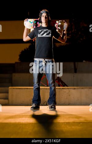 A skateboarder in front of a High School on Friday, June 29, 2007 in Albuquerque, N.M. Stock Photo