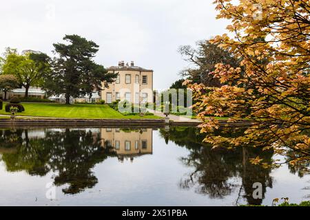 The lake and hall at Thorp Perrow Arboretum, near Bedale, North Yorkshire,England,UK Stock Photo