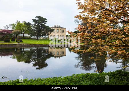 The lake and hall at Thorp Perrow Arboretum, near Bedale, North Yorkshire,England,UK Stock Photo