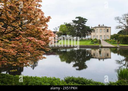 The lake and hall at Thorp Perrow Arboretum, near Bedale, North Yorkshire,England,UK Stock Photo