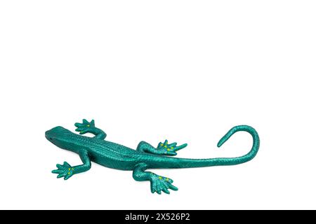 Green rubber toy lizard on white background. Stretchable toy. Anti-stress. Horizontal photo. For text. Stock Photo