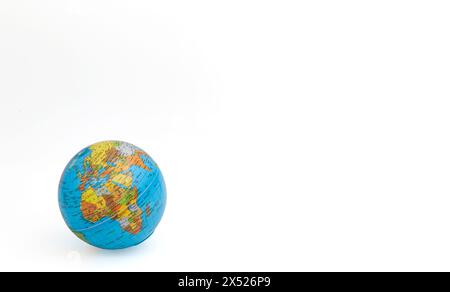 Model of the world lying on its side, globe or Earth isolated on a white background. Africa, Europe, India, Turkey, Iran, Iraq. Horizontal. For text. Stock Photo