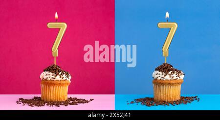 Two birthday cupcakes with the number 7 - Blue and pink background Stock Photo