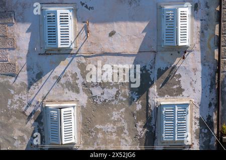 Shuttered windows on a building in the old town of Dubrovnik, Croatia. Stock Photo
