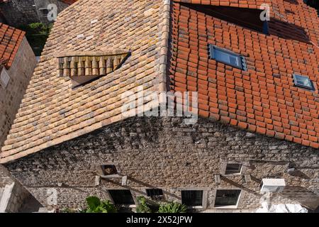 Dubrovnik roof showing new tiles replaced after bombing and old tiles. Stock Photo