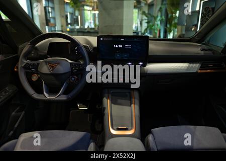 black Interior fully electric CUPRA Born, steering wheel, Driver's column, digital instrument panel, Spanish innovation in Berlin, Germany - April 24, Stock Photo