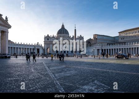 View of Saint Peter's Square in Vatican City, the papal enclave in Rome, with the iconic Vatican obelisk at its center, and St. Peter's Basilica Stock Photo