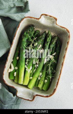 Freshly cooked asparagus appetizer in ceramic baking dish Stock Photo