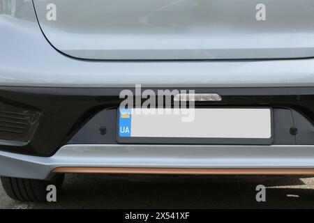 Car with vehicle registration plate outdoors, closeup Stock Photo
