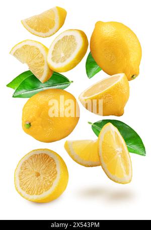 Ripe lemon fruits, lemon leaves and slices falling down on white background. Clipping path. Stock Photo