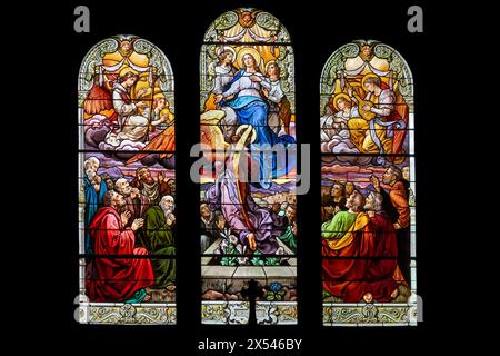 Stained glass windows made in 1922 representing the Assumption of the Virgin Mary inside the Sacré-Cœur Church of Jarville-la-Malgrange. Stock Photo