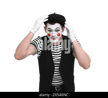 Funny mime artist in beret posing on white background Stock Photo