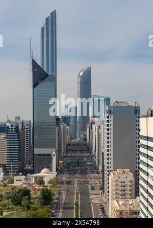 A picture of the Khalifa Bin Zayed Street in Downtown Abu Dhabi, with the Al Markaziyah West buildings at the far center, like the World Trade Center Stock Photo