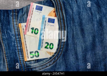 Concept of financial problems, last money. 50 euro banknote in jeans pocket. 2 Stock Photo