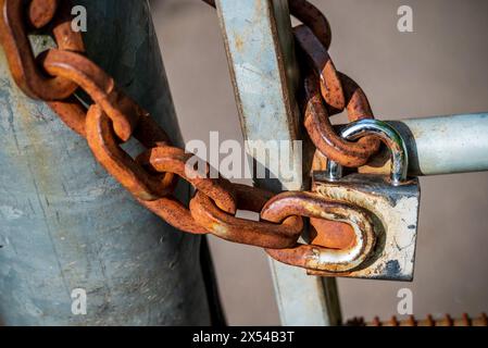 Padlock with rusty chain. Stock Photo