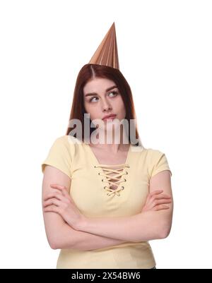 Sad woman in party hat on white background Stock Photo