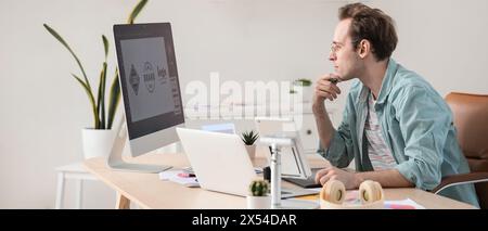 Male graphic designer developing logotype in office Stock Photo