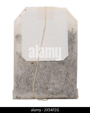 Disposable tea bag with paper label on a string on isolated background Stock Photo
