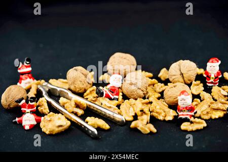 walnut (Juglans regia), Walnuts with nutcrackers and Santas Stock Photo