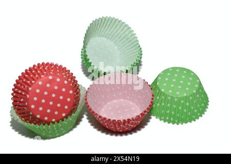 Paper forms of red and green, disposable, lie on a white background. Stock Photo