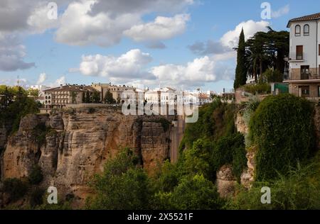 Ronda, Spain - 27th April, 2024: View of El Tajo ravine and houses buit on the edge of the cliff Stock Photo