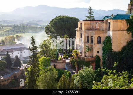 Ronda, Spain - 29h April, 2024: View of El Tajo ravine and houses buit on the edge of the cliff Stock Photo