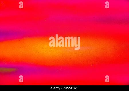 A fragment of colorful graffiti painted on a wall. Abstract urban background for design. Spray painting art. Stock Photo
