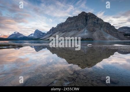 Crowfoot Mountain reflected in Bow Lake in the Canadian Rockies, Banff National Park, Alberta, Canada.  Autumn (September) 2016. Stock Photo