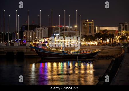 The traditional dhow on Doha Corniche, a waterfront promenade along Doha Bay in the capital city Qatar City. Stock Photo