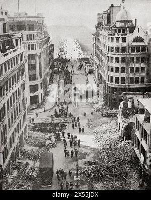 The approach to London Bridge after a German bombing attack, September 1940.  Civilians making their way to work amongst the rubble.  From The War in Pictures, Sixth Year. Stock Photo