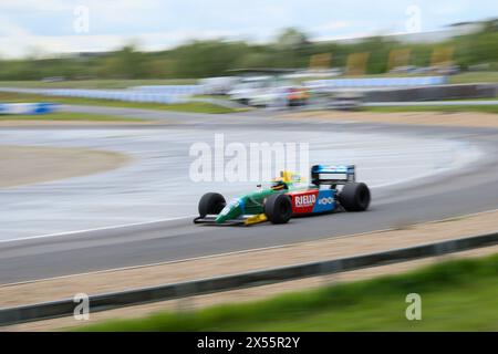 F1 Benetton B190 (ex Nelson Piquet car) being driven at Italian Car Day, Brooklands on 4th May 2024,Weybridge,Surrey,UK Stock Photo