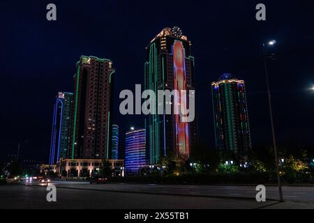 The Grozny City skyscrapers and the street light in the downtown of Grozny, the capital of Chechen Republic, Southern Russia, during the night. Stock Photo